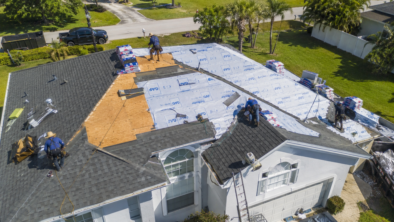 A home roof being rebuilt after storm damage
